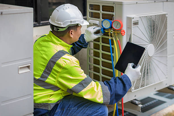 Professional Heat Pump Repair technician working in Boynton Beach, FL